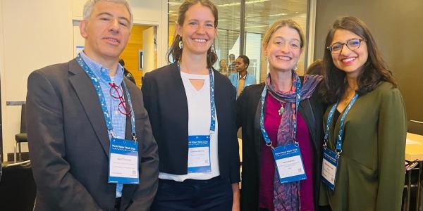 Sasha and Aquaya researchers at targeted subsidy presentation