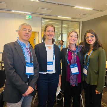 Sasha and Aquaya researchers at targeted subsidy presentation
