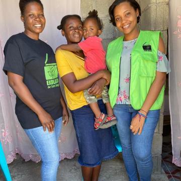 EkoLakay customer, Edeline La Fosse, with SOIL staff Carine Roberts and Algate Joseph