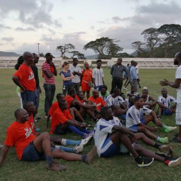 The SOIL team getting some pre-game words of encouragement during a soccer game earlier this year