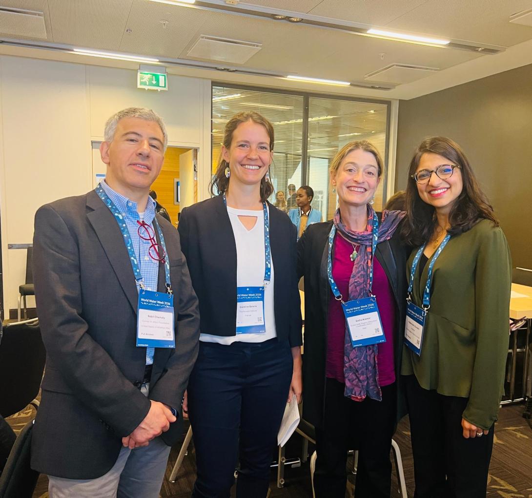 Sasha and Aquaya researchers at targeted subsidy presentation