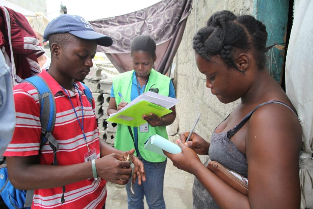 Frantz (left) working with SOIL's EkoLakay in Cap-Haïtien, 2015. Photo by Vic Hinterlang.