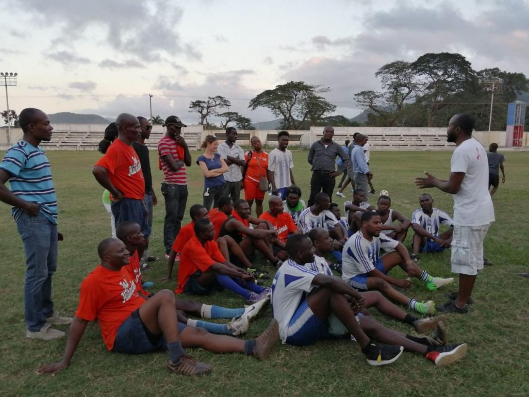 The SOIL team getting some pre-game words of encouragement during a soccer game earlier this year