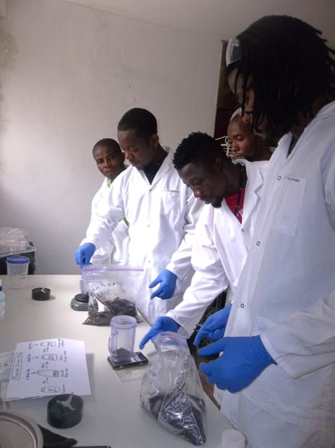The Port-au-Prince team examines samples in our new lab!